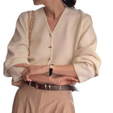 KANING French Solid Color V-Neck Knitted Cardigan Women 2026 Early Autumn Wearing A New Design Sweater Outside The Female