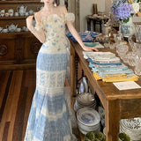 [Baby Ning] French Open Shoulder To Close The Waist Petal Crushed Flower Top + Gradually Changed Fishtail Half Skirt Woman Two-Piece Skirt